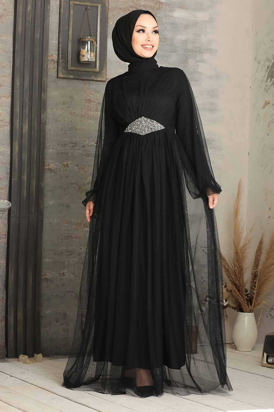 stylish girl posing in elegant black dress for fashion shoot, on grey Stock  Photo by LightFieldStudios